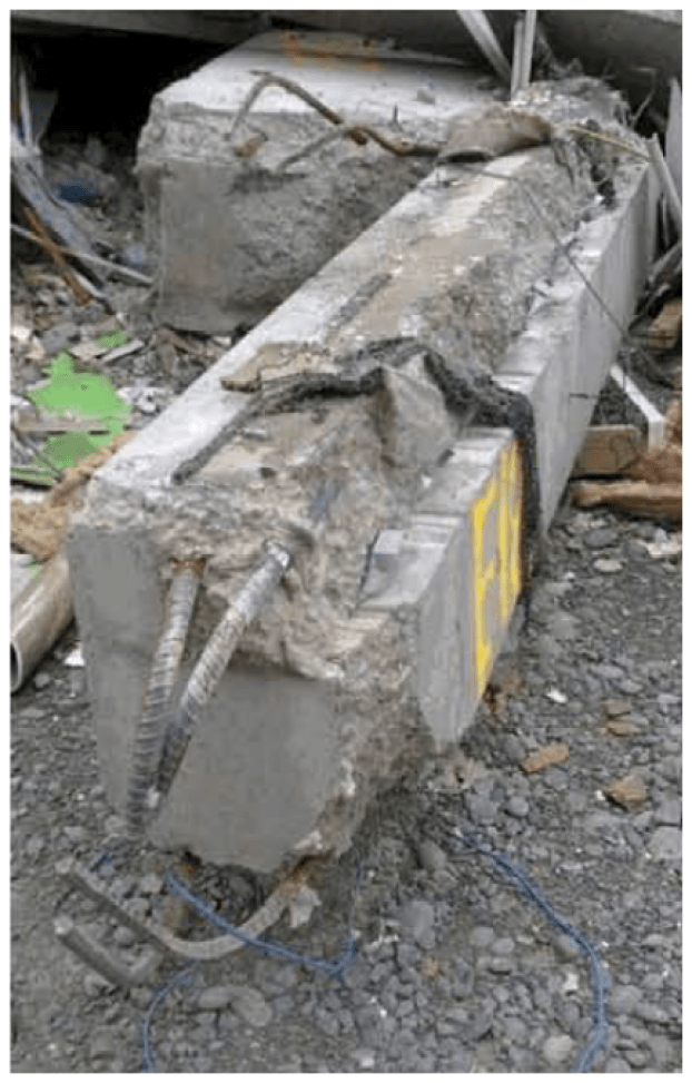 Image of a pre-cast beam from the CTV building after its collapse.  Notice the smooth surface on the top where it delaminated from the adjacent slab.  This was found to be a possible reason why the building collapsed due to the earthquakes.