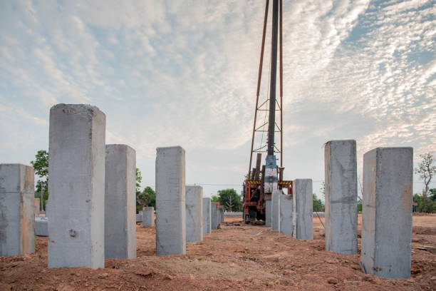 Precast concrete driven piles being installed on-site.